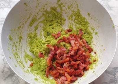 Mixing guacamole ingredients together