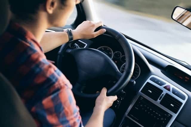 Teenager driving a car
