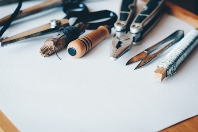 A range of essential tools on a large white piece of paper