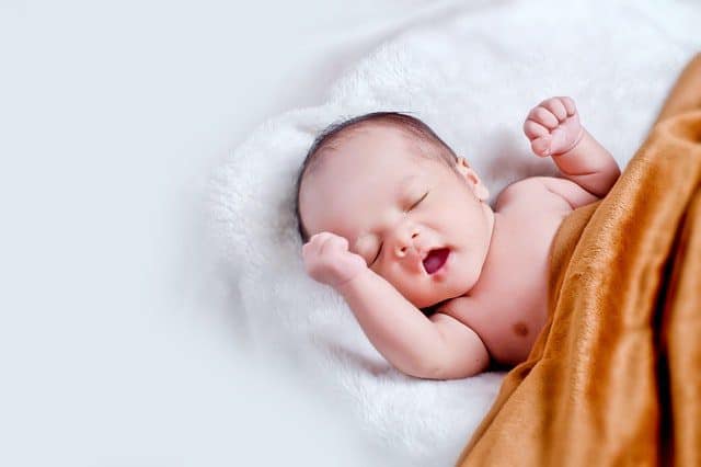 Newborn baby yawning after being brought home