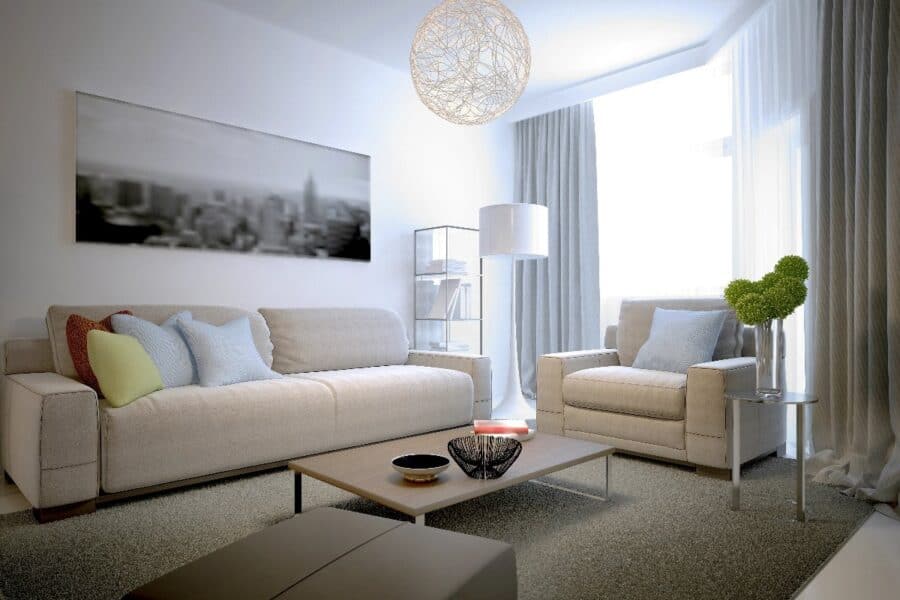 Modern living room refresh with neutral sofas, colourful cushions, natural light and stylish décor touches.