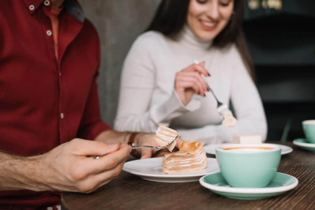 Coffee and cake treat showing affordable luxury on a budget.