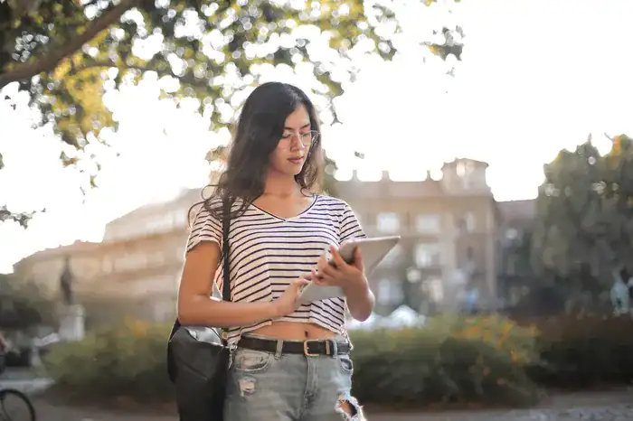 Student carrying ipad bought for her at university.