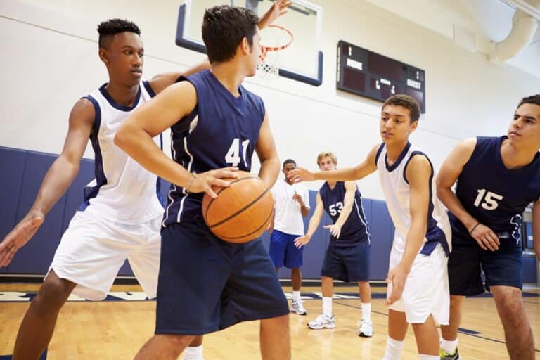 Kids taking part in a PE lesson in a school sports hall