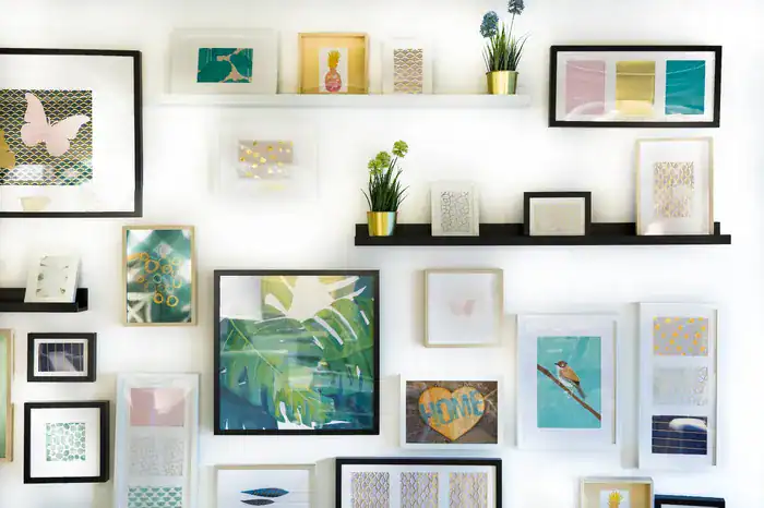 A selection of acrylic photo frames hanging on a wall.