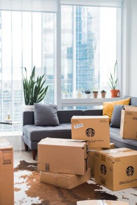Packing boxes stacked in a lounge for a house move.