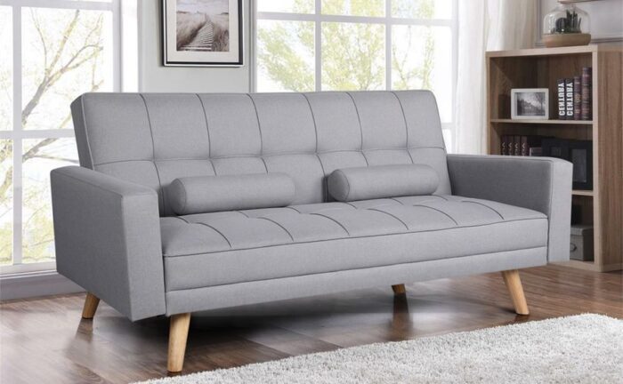 Grey upholstered ofa bed offering multi-purpose bedroom ideas.