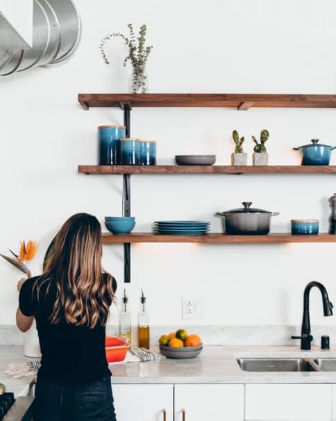 Organised shelves in the kitchen of an elegant home.