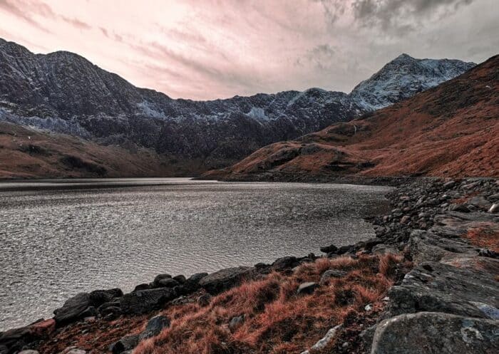 A moody and beautiful image of Snowdon in Wales during Autumn.