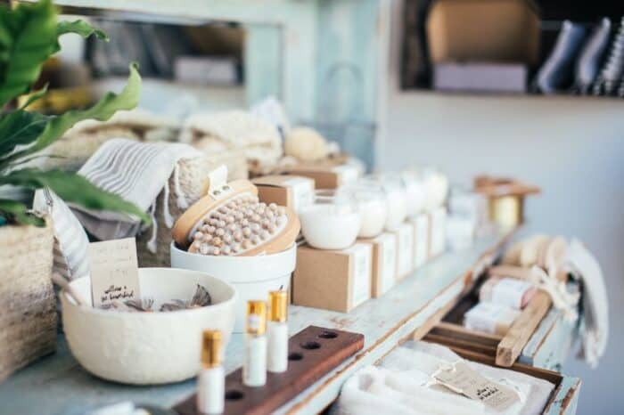A collection of eco-friendly skincare products displayed for sale, featuring an assortment of natural, organic, and sustainable items. The picture showcases various types of products like facial creams, serums, and masks, all in environmentally friendly packaging. Each item is clearly labeled with its ingredients and benefits, emphasizing their organic and cruelty-free nature. The products are artfully arranged against a clean, neutral background, creating an appealing and informative visual.