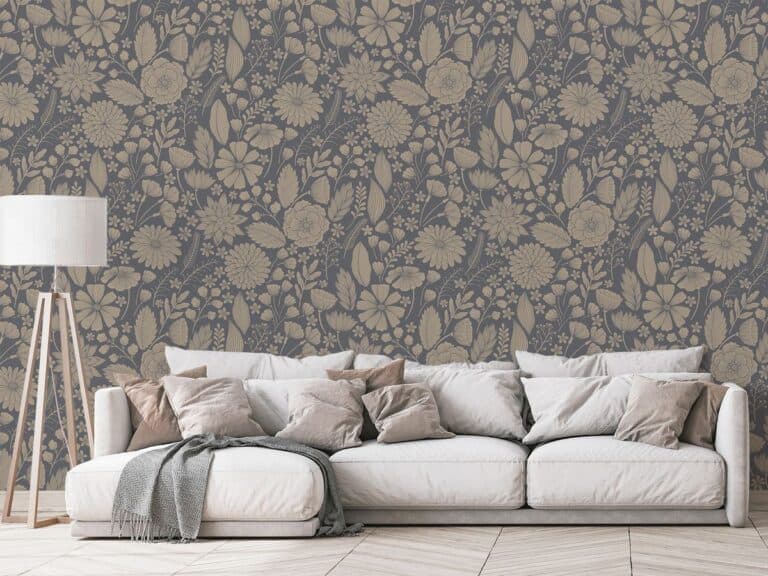 A comfortable living room with a large beige couch filled with cushions, against a decorative floral customisable wallpaper, beside a tripod floor lamp.