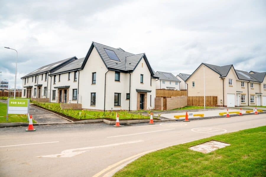 New build homes for sale in a rural location with modern design and solar panels on roofs.