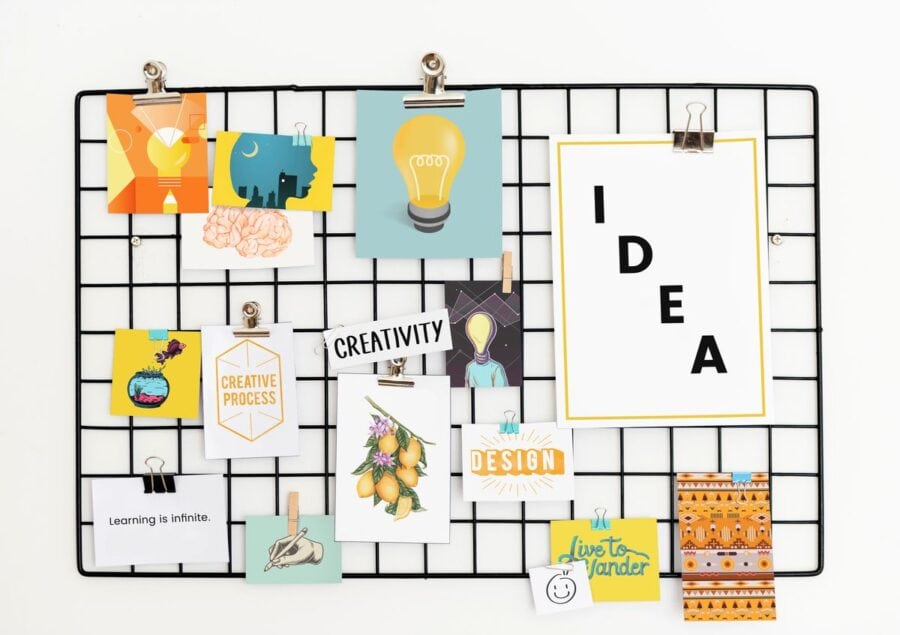 A moodboard with colorful images, drawings, and motivational words like "IDEA," "CREATIVITY" and "CREATIVE PROCESS".