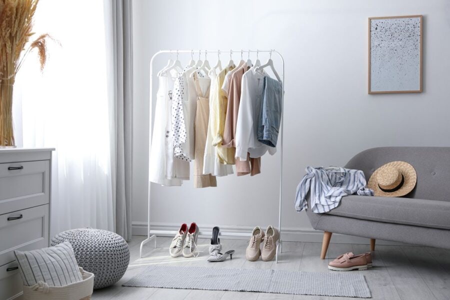 Clothes and accessories neatly organised on a hanger and sofa for outfit preparation as part of a Sunday evening routine.