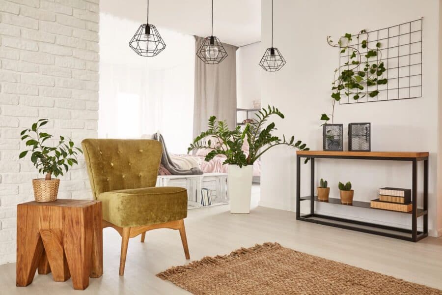 Top furniture shopping tips: Stylish home accessories like cushions, a cozy throw, and a textured rug to transform your space.