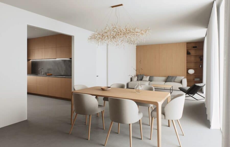 Timeless furniture setup featuring a neutral sofa, wooden coffee table, and elegant decor, aligning with top furniture shopping tips.