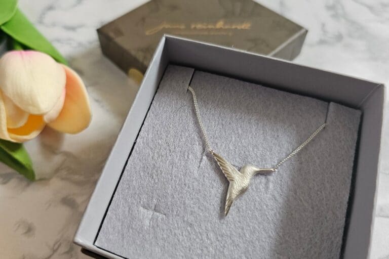 Jana Reinhardt jewellery review – sterling silver hummingbird necklace in its gift box, beautifully presented with soft grey lining.