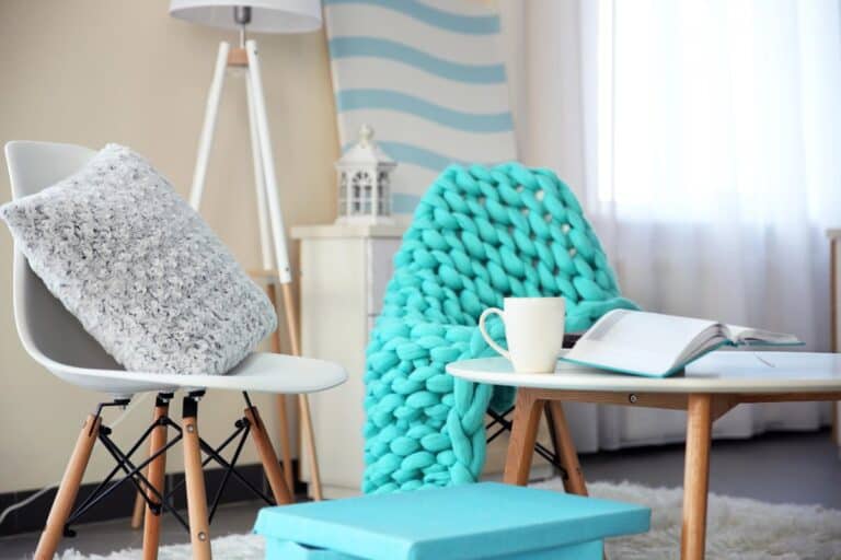 Book nook project cosy reading corner with blanket, cushion and coffee