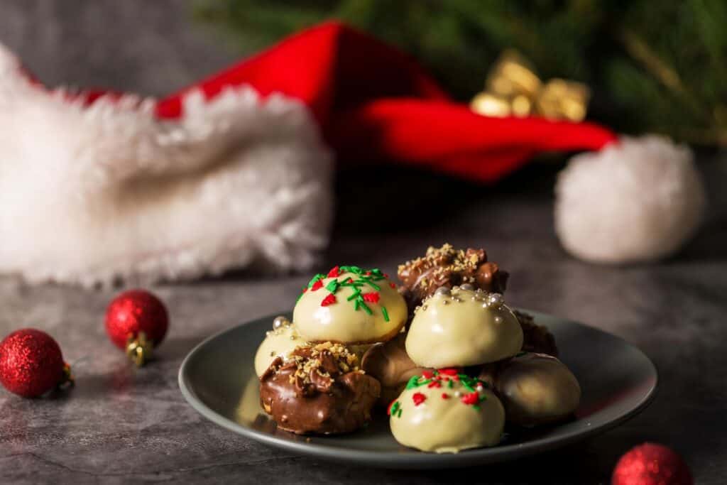 Festive chocolate truffles with sprinkles on a plate — a sweet idea for Christmas Gifts for Chocolate Lovers