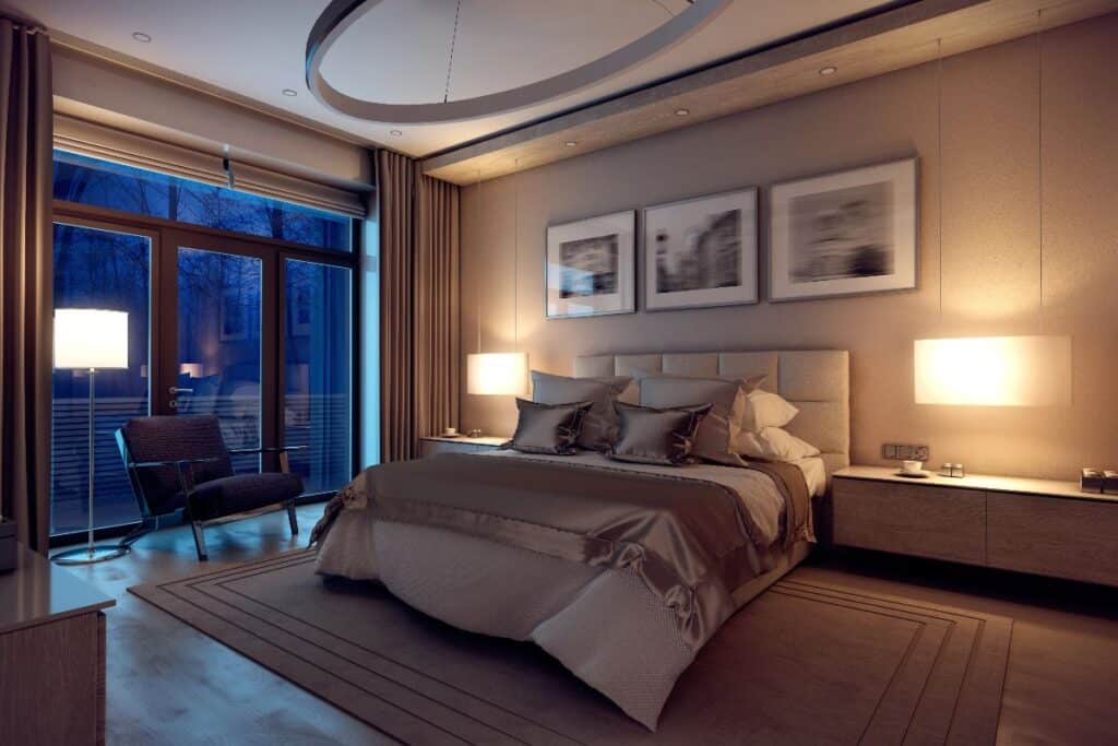 Calm, uncluttered bedroom with warm lamps, heavy curtains and a neatly made bed—ideal setup for a better night’s sleep.