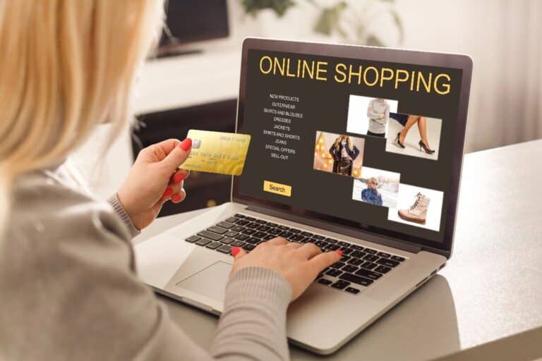 Save money shopping online in the UK with a shopper browsing an online store on a laptop