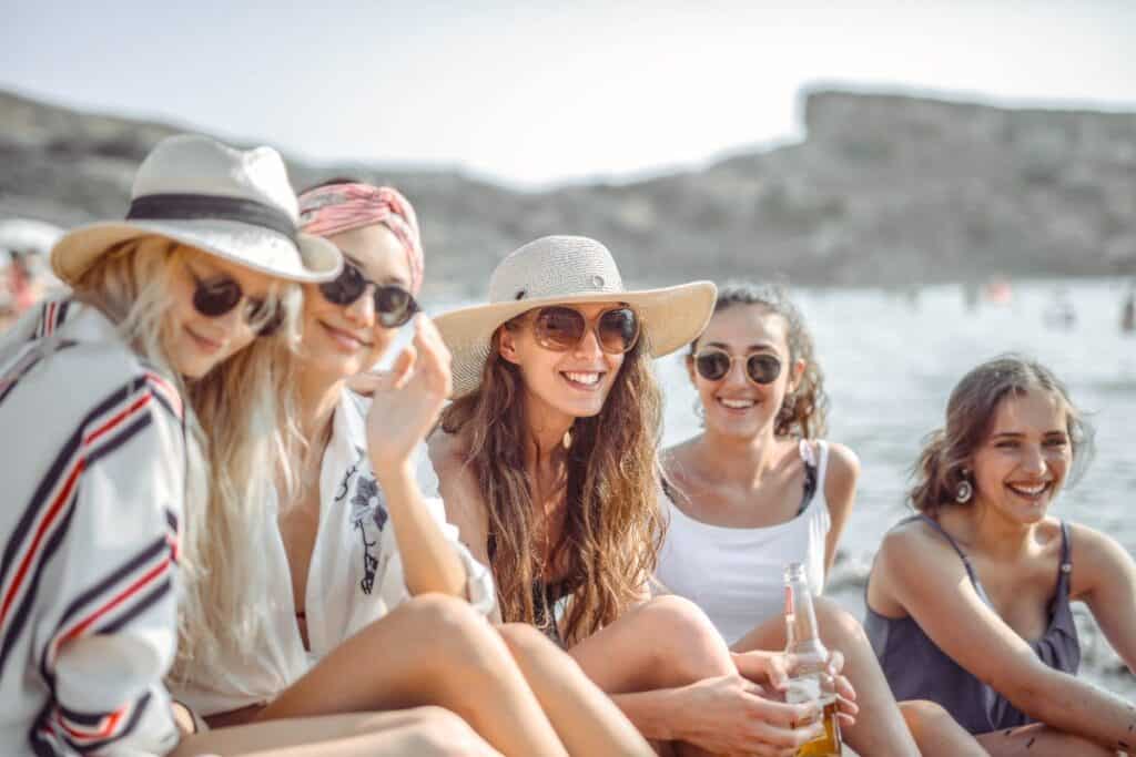 A great hat and the right sunglasses do half the work for any beach day outfit.