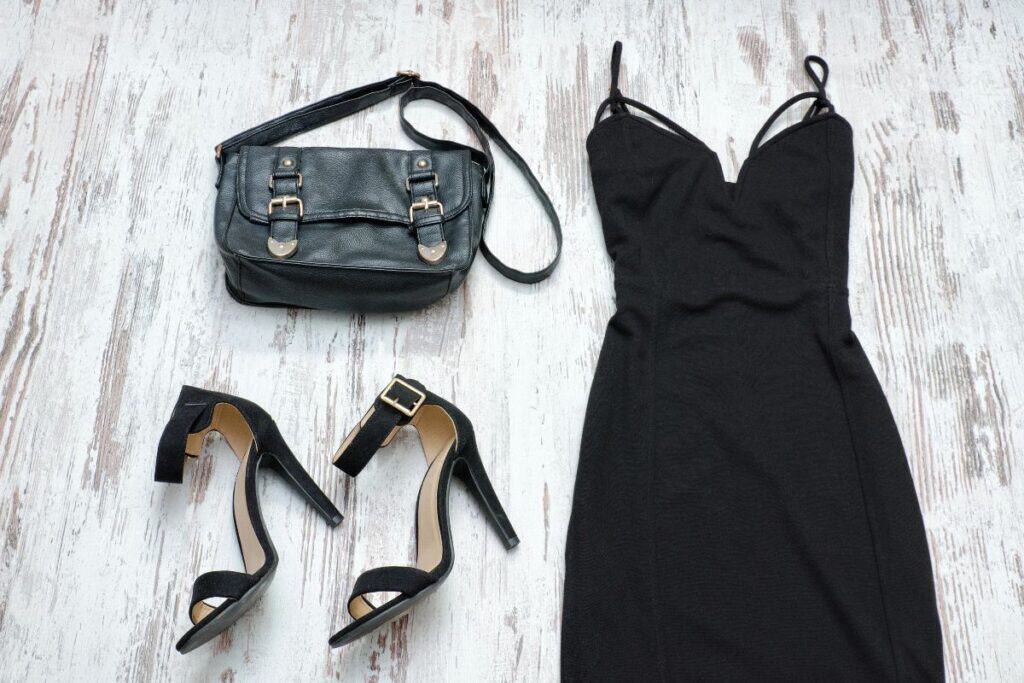 Black dress styled with black heels and handbag for evening wear outfit ideas.