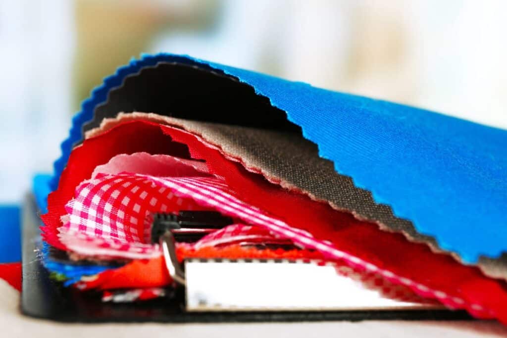 Close-up of colourful fabric samples for home and garden DIY projects.