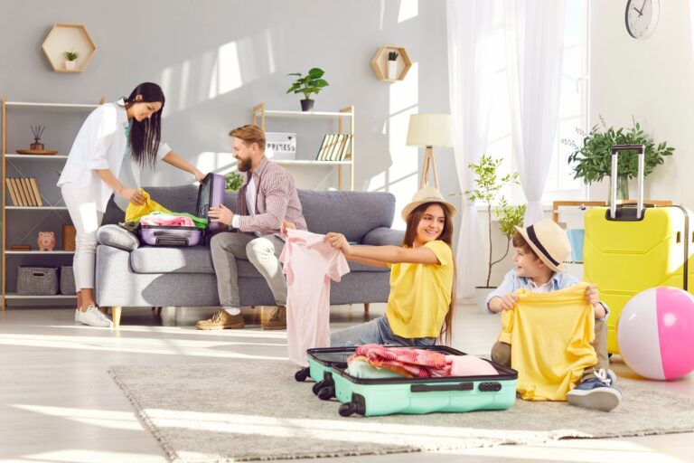 Family packing suitcases at home before a trip abroad.