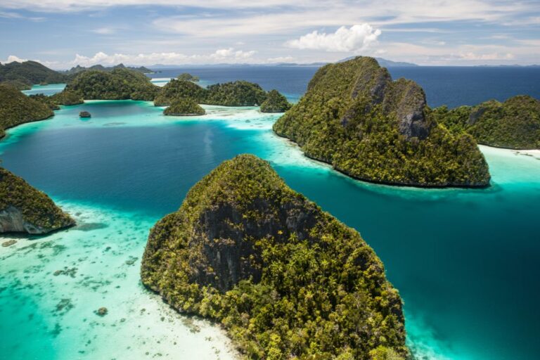 Raja Ampat islands surrounded by turquoise water in Indonesia.
